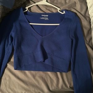 a long sleeved blue tight shirt